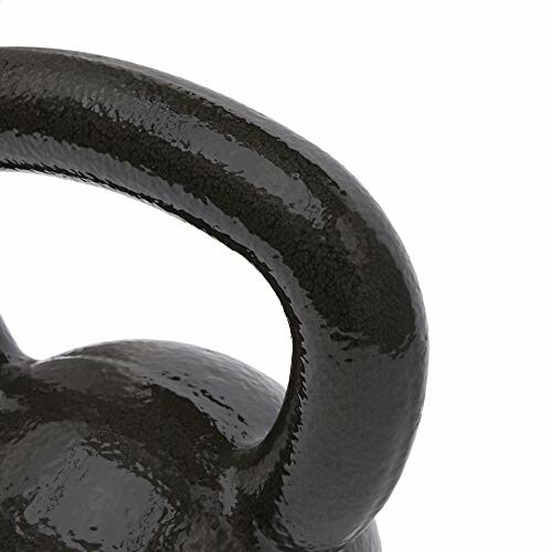 Close-up view of a black kettlebell handle.