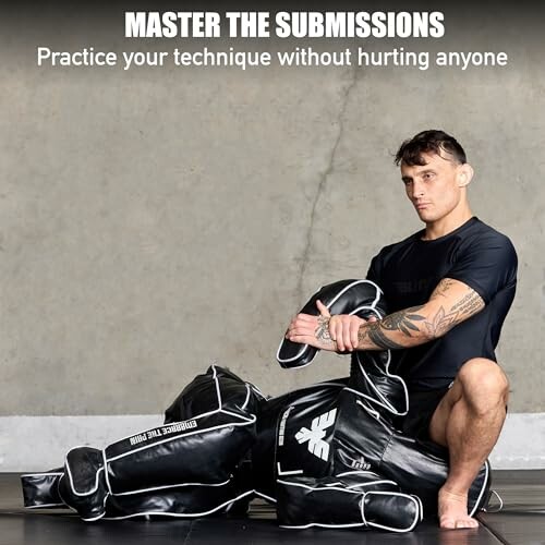 Man practicing submission techniques with a training dummy.