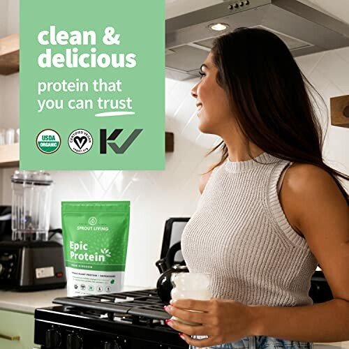 Woman holding a protein shake in a kitchen with a bag of Epic Protein on the counter.